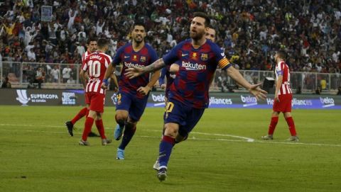 Barcelona's Lionel Messi celebrates after scoring his side first goal during the Spanish Super Cup semifinal soccer match between Barcelona and Atletico Madrid at King Abdullah stadium in Jiddah, Saudi Arabia, Friday, Jan. 10, 2020. (AP Photo/Amr Nabil)