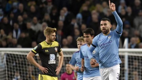 Manchester City's Nicolas Otamendi, right, celebrates after scoring his side's opening goal during the English League Cup soccer match between Manchester City and Southampton at Etihad stadium in Manchester, England, Tuesday, Oct. 29, 2019. (AP Photo/Rui Vieira)