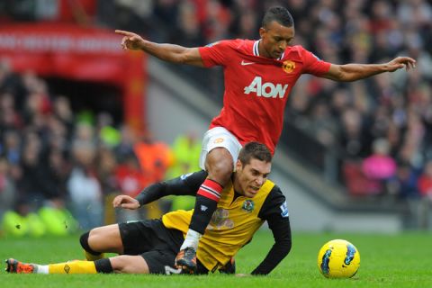 Manchester United's Portuguese midfielder Nani (up) vies with Blackburn Rovers' Spanish striker Ruben Rochina during the English Premier League football match between Manchester United and Blackburn Rovers at Old Trafford in Manchester, north-west England on December 31, 2011. AFP PHOTO/ANDREW YATES

RESTRICTED TO EDITORIAL USE. No use with unauthorized audio, video, data, fixture lists, club/league logos or live services. Online in-match use limited to 45 images, no video emulation. No use in betting, games or single club/league/player publications (Photo credit should read ANDREW YATES/AFP/Getty Images)
