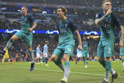 Tottenham Hotspur forward Fernando Llorente, center, celebrates his side's third goal with his teammates during the Champions League quarterfinal, second leg, soccer match between Manchester City and Tottenham Hotspur at the Etihad Stadium in Manchester, England, Wednesday, April 17, 2019. (AP Photo/Jon Super)