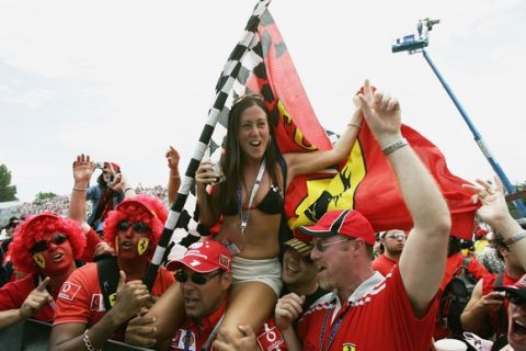 MONTREAL, CANADA - JUNE 13:  Ferrari Tifosi invade the track after the Canadian Formula One Grand Prix held on June 13, 2004, at the Circuit Gilles Villeneuve, in Montreal, Canada. (Photo by Clive Mason/Getty Images)