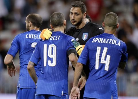 Italy goalkeeper Gianluigi Donnarumma celebrates with teammates his side's 3-0 win over Uruguay, at the end of a friendly soccer match at the Nice Allianz Riviera stadium, France, Wednesday, June 7, 2017. (AP Photo/Claude Paris)