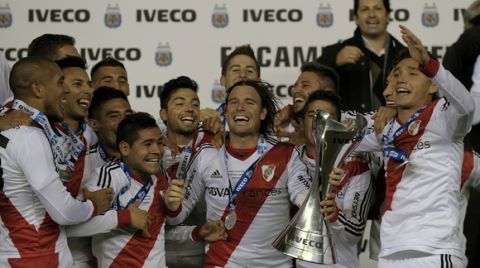 River Plate's footballers celebrate after defeating Quilmes by 5-0 and winning the Argentine First Division Championship, at the Monumental stadium in Buenos Aires, Argentina, on May 18, 2014.  AFP PHOTO / Alejandro PAGNI        (Photo credit should read ALEJANDRO PAGNI/AFP/Getty Images)