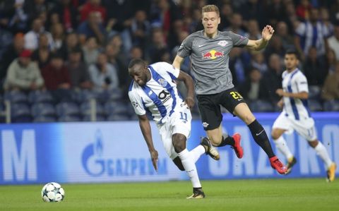 Porto's Moussa Marega, left, vies for the ball with Leipzig's Marcel Halstenberg during the Champions League group G soccer match between FC Porto and RB Leipzig at the Dragao stadium in Porto, Portugal, Wednesday, Nov. 1, 2017. (AP Photo/Luis Vieira)
