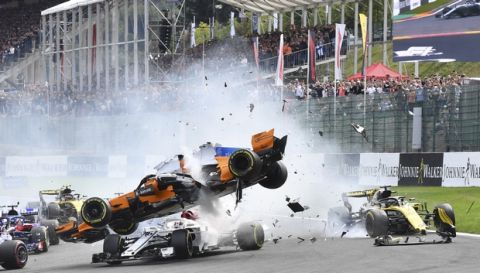 Mclaren driver Fernando Alonso of Spain, center top, crashes at the start of the Belgian Formula One Grand Prix in Spa-Francorchamps, Belgium, Sunday, Aug. 26, 2018. (AP Photo/Geert Vanden Wijngaert)