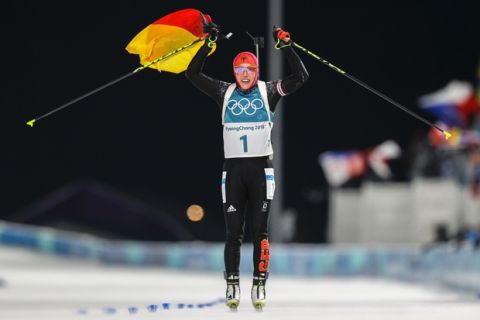 Laura Dahlmeier, of Germany, crosses the finish line to win the gold medal in the women's 10-kilometer biathlon pursuit at the 2018 Winter Olympics in Pyeongchang, South Korea, Monday, Feb. 12, 2018. (AP Photo/Andrew Medichini)