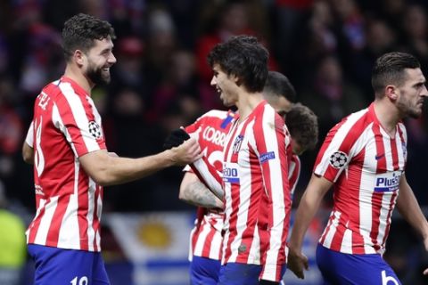 Atletico Madrid's Felipe, left, celebrates with Atletico Madrid's Joao Felix after scoring the the second goal during the Champions League Group D soccer match between Atletico Madrid and Lokomotiv Moscow at Wanda Metropolitano stadium in Madrid, Spain, Wednesday, Dec. 11, 2019. (AP Photo/Manu Fernandez)