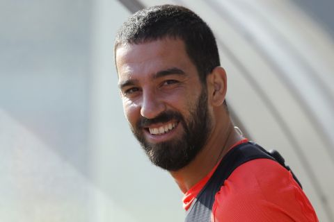 FILE - In this Monday, Aug. 1, 2016 file photo, FC Barcelona's Arda Turan smiles during a training session at the Sports Center FC Barcelona Joan Gamper in Sant Joan Despi, Spain. Fresh off a hat-trick, Turkey midfielder Arda Turan is hoping for another chance on Saturday Dec. 10, 2016, to prove he can play alongside Barcelonas best. (AP Photo/Manu Fernandez)