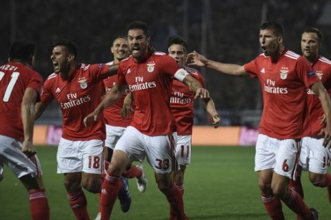 Benfica's players celebrate their sides first goal against PAOK during the Champions League playoffs, second leg, soccer match between PAOK and Benfica at theToumba stadium in the northern Greek port city of Thessaloniki, on Wednesday, Aug. 29, 2018. (AP Photo/Giannis Papanikos)