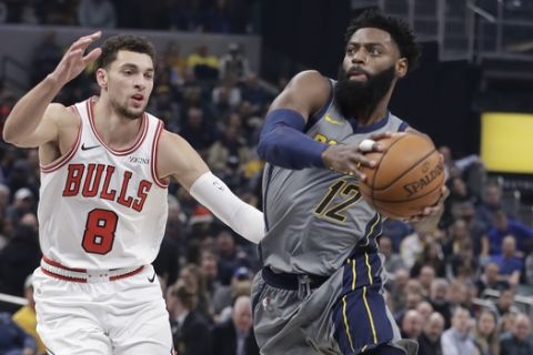 Indiana Pacers' Tyreke Evans (12) goes to the basket against Chicago Bulls' Zach LaVine during the first half of an NBA basketball game, Tuesday, Dec. 4, 2018, in Indianapolis. (AP Photo/Darron Cummings)