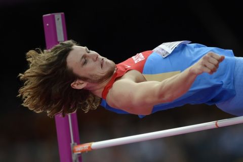Russia's Ivan Ukhov competes in the men's high jump qualifying round at the athletics event during the London 2012 Olympic Games on August 5, 2012 in London. AFP PHOTO / ADRIAN DENNISADRIAN DENNIS/AFP/GettyImages