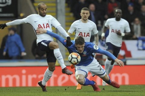 Tottenham's Loucas Moura, left, and Rochdale's Ryan Delaney challenge for the ball during the English FA Cup fifth round soccer match between Rochdale AFC and Tottenham Hotspur at the Crown Oil Arena in Rochdale, England, Sunday, Feb. 18, 2018. (AP Photo/Rui Vieira)