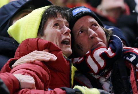 Sue Sweeney, left, the mother of Emily Sweeney of the United States, cries out as her daughter crashes on the final run during the women's luge final at the 2018 Winter Olympics in Pyeongchang, South Korea, Tuesday, Feb. 13, 2018. (AP Photo/Wong Maye-E)