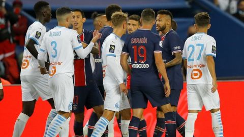 PSG's Neymar, second right, after a clash during the French League One soccer match between Paris Saint-Germain and Marseille at the Parc des Princes in Paris, France, Sunday, Sept.13, 2020. (AP Photo/Michel Euler)