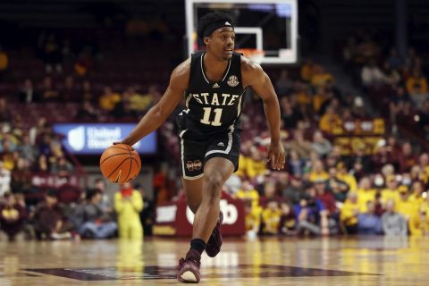 Mississippi State guard Eric Reed Jr. (11) handles the ball during the first half of an NCAA college basketball game against Minnesota, Sunday, Dec. 11, 2022, in Minneapolis.(AP Photo/Stacy Bengs)