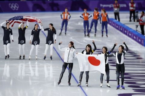 Gold medalist team Japan, front, and bronze medalist team U.S.A. celebrate, while silver medalist team Netherlands appears dejected after the women's team pursuit speedskating race at the Gangneung Oval at the 2018 Winter Olympics in Gangneung, South Korea, Wednesday, Feb. 21, 2018. (AP Photo/Vadim Ghirda)