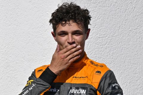 Second placed British Formula One driver Lando Norris of McLaren F1 Team celebrates on the podium after the Formula One Hungarian Grand Prix auto race, at the Hungaroring racetrack in Mogyorod, near Budapest, Hungary, Sunday, July 23, 2023. (AP Photo/Denes Erdos)