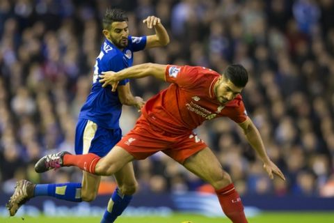 Liverpool's Emre Can, right, fights for the ball against Leicester City's Riyad Mahrez during the English Premier League soccer match between Liverpool and Leicester City at Anfield Stadium, Liverpool, England, Saturday, Dec. 26, 2015. (AP Photo/Jon Super)