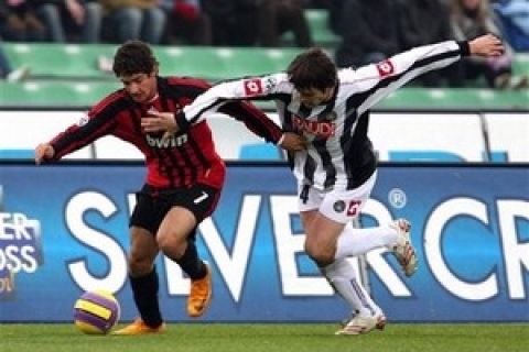 AC Milan Brazilian forward Pato, left, challenges for the ball with Udinese's Aleksandar Lukovic during the Italian Serie A first division soccer match between Udinese and Milan at the Friuli Stadium in Udine, Italy, Sunday, Gen. 20, 2008.  (AP Photo/Paolo Giovannini) 