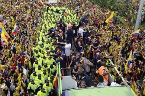 Members of Colombia¿s national soccer team are welcomed home from the World Cup, in Bogota, Colombia, Sunday, July 6, 2014. Thousands of fans turned out for the Sunday homecoming of superstar James Rodriguez, his teammates and coach Jose Pekerman following their 2-1 loss to Brazil in the quarterfinals on Friday. (AP Photo/Fernando Vergara) Colombia Brazil WCup Homecoming