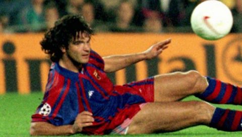 Dynamo kiev's striker Andrei Shevchenko, who scored a hat-trick, passes the ball away from Barcelona's Portuguese defender Fernando Couto during an European Champions League match in Barcelona Wednesday Nov. 5 1997 which Dynamo won 4-0. (AP Photo/Cesar Rangel)