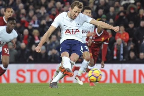 Tottenham's Harry Kane scores his side's second goal during the English Premier League soccer match between Liverpool and Tottenham Hotspur at Anfield in Liverpool, England, Sunday, Feb. 4, 2018. (AP Photo/Rui Vieira)
