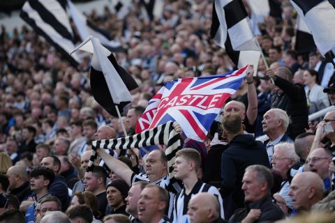 Newcastle fans wait for the start of an English Premier League soccer match between Newcastle and Arsenal at St James' Park stadium in Newcastle, Sunday, May 7, 2023. (AP Photo/Jon Super)