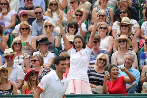 Tennis - Boodles Tennis Challenge - Stoke Park, Buckinghamshire - 25/6/15  Serbia's Novak Djokovic with a fan  Action Images via Reuters / Paul Childs  Livepic   ORG XMIT: UKW1bi