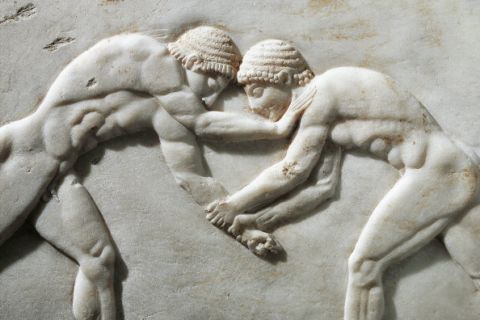 UNSPECIFIED - CIRCA 1900:  Greek civilization, 6th century b.C. Plinth of kouros statue depicting wrestlers, 510 b.C. Detail. Relief from the Kerameikos necropolis in Athens, Greece.  (Photo By DEA / G. NIMATALLAH/De Agostini/Getty Images)