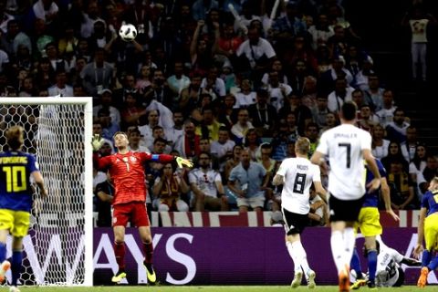Sweden's Ola Toivonen, right, scores the opening goal during the group F match between Germany and Sweden at the 2018 soccer World Cup in the Fisht Stadium in Sochi, Russia, Saturday, June 23, 2018. (AP Photo/Michael Probst)