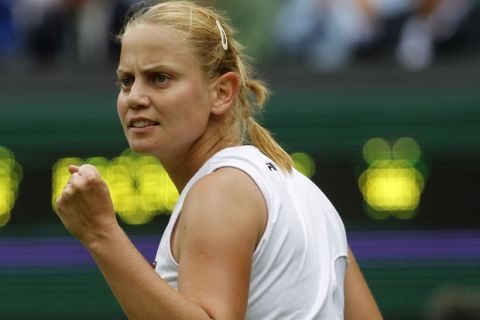 Australia's Jelena Dokic reacts during the first round match against  Italy's Francesca Schiavone at the All England Lawn Tennis Championships at Wimbledon, Monday, 20 June, 2011. (AP Photo/Anja Niedringhaus)