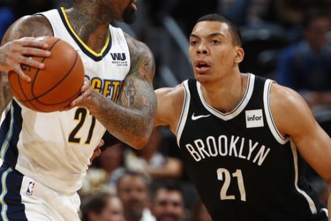 Denver Nuggets forward Wilson Chandler (21) and Brooklyn Nets forward Jacob Wiley (21) in the second half of an NBA basketball game Tuesday, Nov. 7, 2017, in Denver. The Nuggets won 112-104. (AP Photo/David Zalubowski)