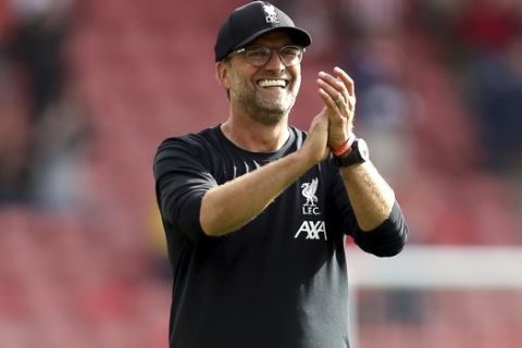 Liverpool manager Jurgen Klopp applauds the fans after the final whistle of the English Premier League soccer match between Southampton and Liverpool, at St Mary's, in Southampton, England, Saturday, Aug. 17, 2019. (Steven Paston/PA via AP)