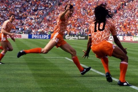 Marco Van Basten, at center, of the Netherlands soccer team celebrate with teammate Ruud Gullit, right, after scoring the winning goal during the final game of the European soccer Championships, on June 25, 1988 in Munich, West Germany. The Netherlands defeated Soviet Union 2-0 to win the Championship. (Ap Photo/Carlo Fumagalli)