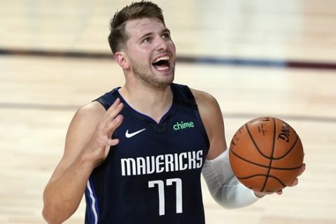 Dallas Mavericks' Luka Doncic (77) reacts after being called for a foul against the Los Angeles Clippers during the first half of an NBA basketball first round playoff game Sunday, Aug. 23, 2020, in Lake Buena Vista, Fla. (AP Photo/Ashley Landis, Pool)