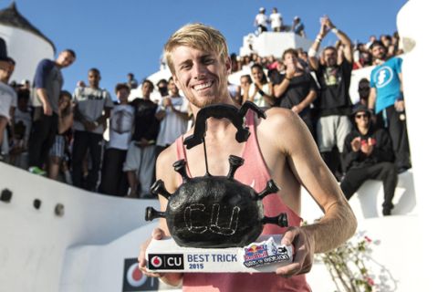 Alfred Scott of the United States poses for a portrait with a trophy during the finals at the "Red Bull Art of Motion" freerunning competition on Santorini Island, Greece on October 3, 2015