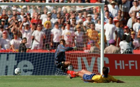 Colombian defender Andres Escobar lies on the ground after scoring an own goal past goalkeeper Oscar Cordoba while trying to stop a shot from US forward John Harkes during the World Cup first round soccer match between the United States and Colombia 22 June 1994 in Los Angeles. The United States beat Colombia 2-1. AFP PHOTO/ROMEO GACAD    (Photo credit should read ROMEO GACAD/AFP/Getty Images)