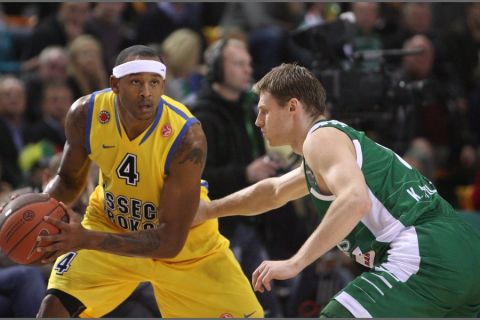 Zalgiris Kaunas's Martynas Pocius (R) vies with Asseco Prokom's J.R. Giddens (L) during their Euroleague group A basketball game in Kaunas on November 3, 2010 AFP PHOTO / PETRAS MALUKAS (Photo credit should read PETRAS MALUKAS/AFP/Getty Images)