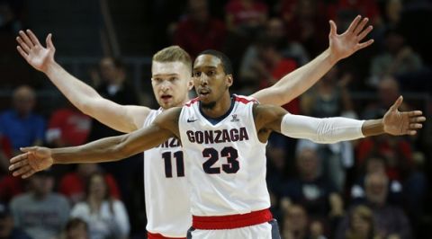 Gonzaga forward Domantas Sabonis (11) and guard Eric McClellan (23) react after their team scored against BYU during the first half of a West Coast Conference tournament NCAA college basketball game Monday, March 7, 2016, in Las Vegas. (AP Photo/John Locher)
