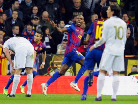 Barcelona's French defender Eric Abidal (C) celebrates after scoring during the Spanish Cup "El clasico" football match Real Madrid vs Barcelona at the Santiago Barnabeu stadium in Madrid on January 18, 2012.   AFP PHOTO/JAVIER SORIANO (Photo credit should read JAVIER SORIANO/AFP/Getty Images)