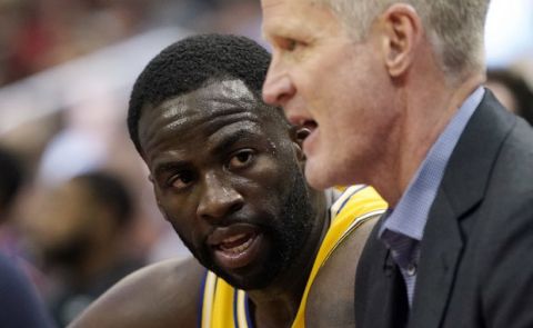 Golden State Warriors' Draymond Green, left, listens to coach Steve Kerr during the second half of an NBA basketball game against the Houston Rockets Thursday, Nov. 15, 2018, in Houston. The Rockets won 107-86. (AP Photo/David J. Phillip)