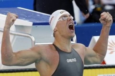 Brazil's Cesar Cielo Filho celebrates after winning the gold medal in the final of the Men's 100m Freestyle at the FINA Swimming World Championships in Rome, Thursday, July 30, 2009. (AP Photo/Michael Sohn)