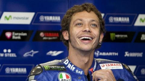 Yamaha MotoGP rider Valentino Rossi of Italy reacts in his pit box during a warm up session at the TT Assen Grand Prix at Assen, Netherlands June 27, 2015. REUTERS/Ronald Fleurbaaij 
Picture Supplied by Action Images