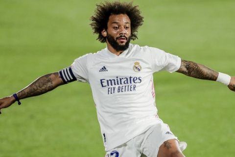 Real Madrid's Marcelo in action during the Spanish La Liga soccer match between Getafe and Real Madrid at the Alfonso Perez stadium in Getafe, Spain, Sunday, April 18, 2021. (AP Photo/Manu Fernandez)