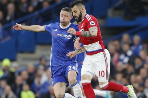 Chelsea's Gary Cahill, left, vies for the ball with Middlesbrough's Alvaro Negredo during the English Premier League soccer match between Chelsea and Middlesbrough at Stamford Bridge stadium in London, Monday, May 8, 2017. (AP Photo/Frank Augstein)