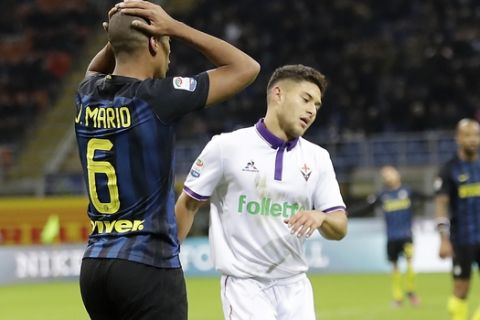Fiorentina's Joshua Giovanni Perez, right, reacts during the Serie A soccer match between Inter Milan and Fiorentina at the San Siro stadium in Milan, Italy, Monday, Nov. 28, 2016. American teenager Joshua Perez has made a strong impression after making his Italian league debut with Fiorentina. (AP Photo/Antonio Calanni)