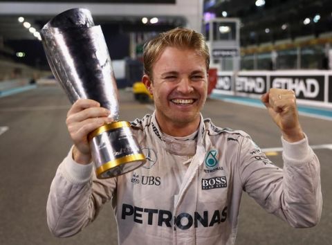 ABU DHABI, UNITED ARAB EMIRATES - NOVEMBER 27:  Nico Rosberg of Germany and Mercedes GP celebrates with his second place trophy after securing the F1 World Drivers Championship during the Abu Dhabi Formula One Grand Prix at Yas Marina Circuit on November 27, 2016 in Abu Dhabi, United Arab Emirates.  (Photo by Clive Mason/Getty Images)