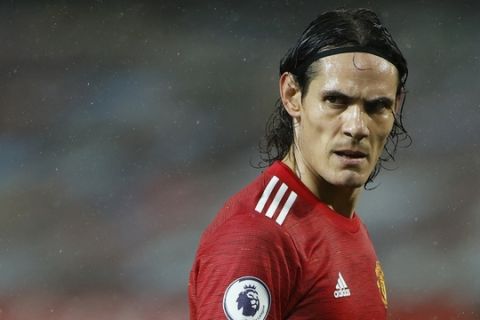 Manchester United's Edinson Cavani reacts during the English Premier League soccer match between Manchester United and Chelsea, at the Old Trafford stadium in Manchester, England, Saturday, Oct. 24, 2020. (Phil Noble/Pool via AP)