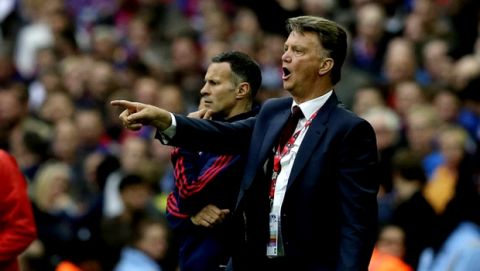 Manchester Uniteds manager Louis van Gaal gestures to his players during the English FA Cup final soccer match between Manchester United and Crystal Palace at Wembley Stadium, London on Saturday May 21, 2016. (AP Photo/Tim Ireland)