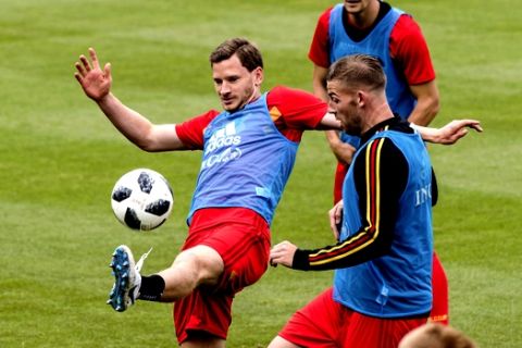 Belgium's Jan Vertonghen, left, Toby Alderweireld, right, and Thomas Meunier challenge for the ball during a training session at the Belgian Football Center in Tubize, Belgium, on Tuesday, June 5, 2018. Belgium is playing a friendly soccer match against Egypt on Wednesday June 6. (AP Photo/Geert Vanden Wijngaert)